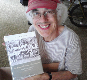 Stephen Wade holding a copy of his book