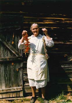 Nellie Kinsey holding a string of leather britches and red peppers, Kinsey Town,  White County, GA, 1989. Photo by Maggie Holtzberg