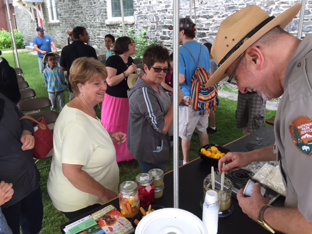 David Blackburn serving pickes at the foodways demonstration tent