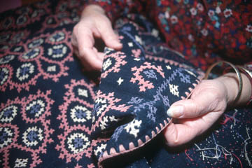 Anahid Kazazian inspecting Armenian Marash embroidery