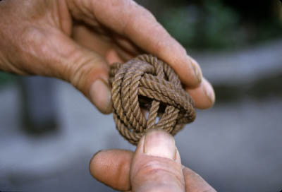 Fisherman Marco Randazzo holding one of his rope sculptures